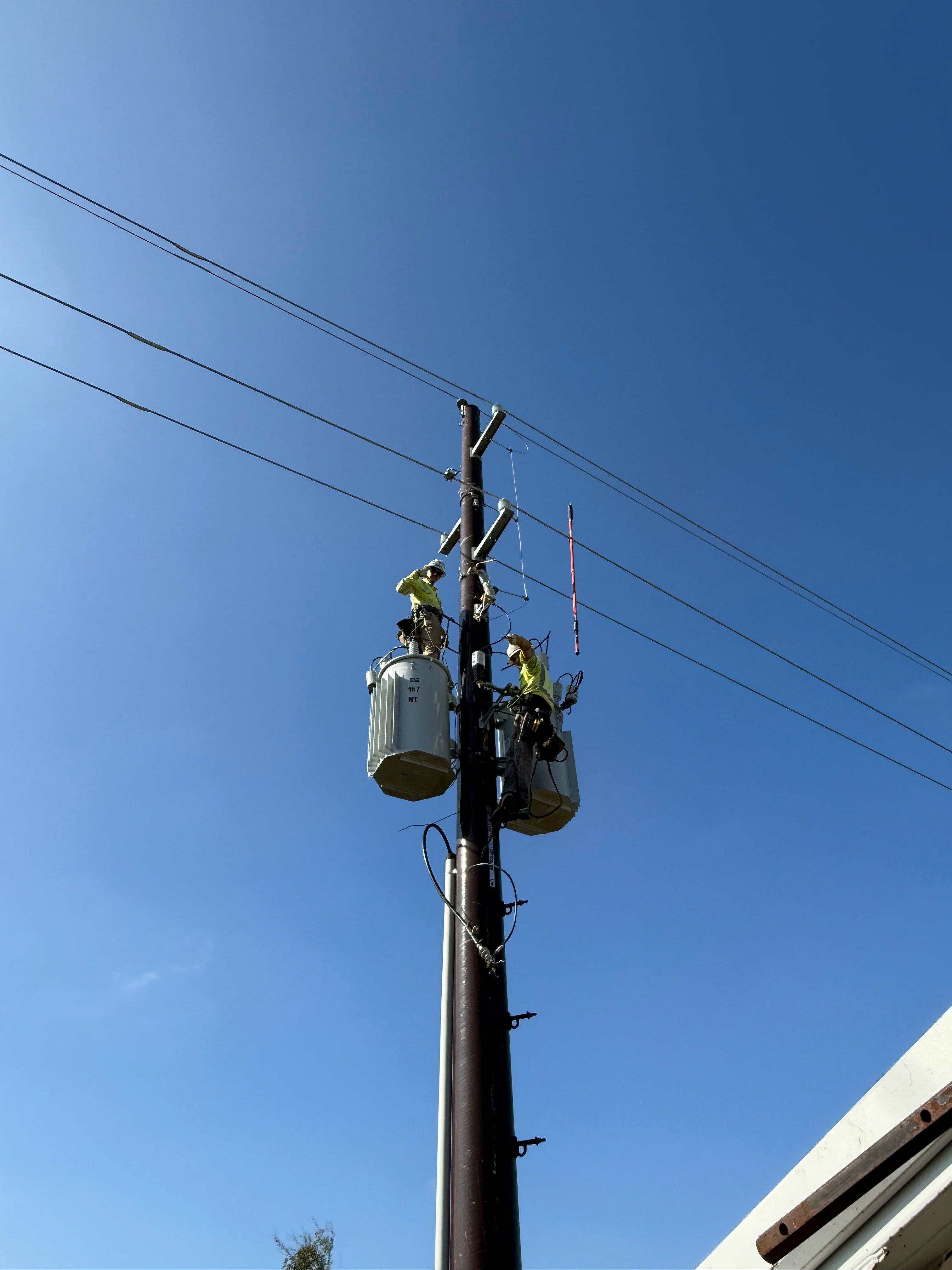 Shayla Gaffney Climbing Utility Pole in Remote Right-of-Way