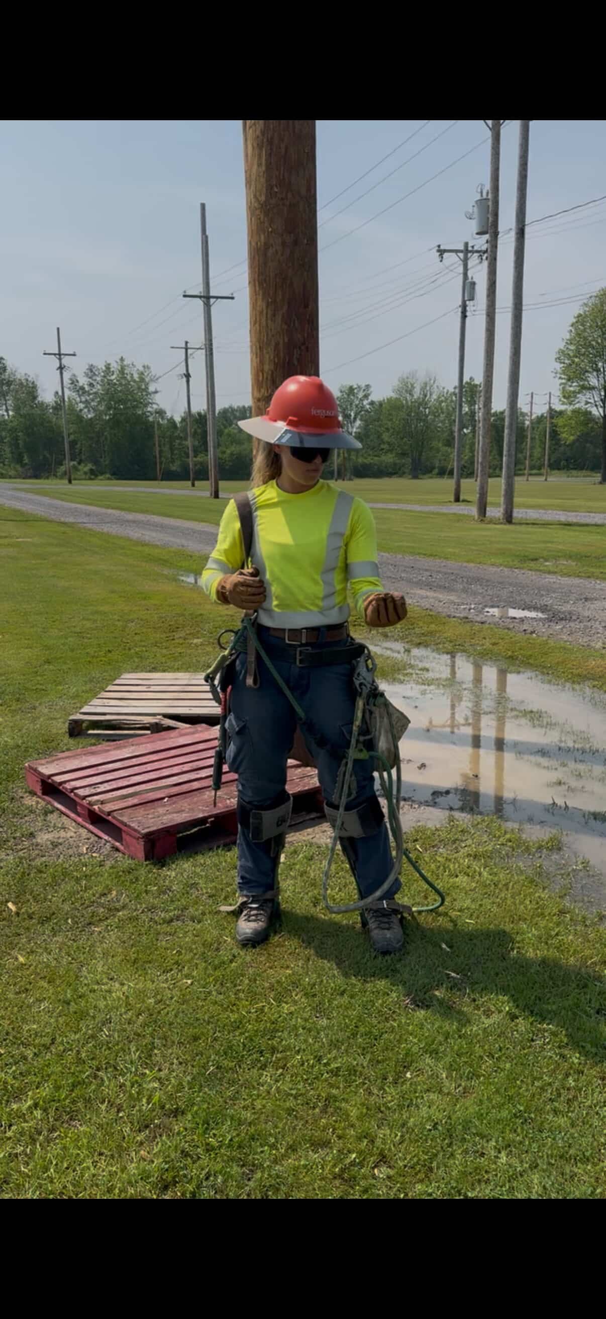 Shayla Gaffney Preparing for Utility Pole Climbing