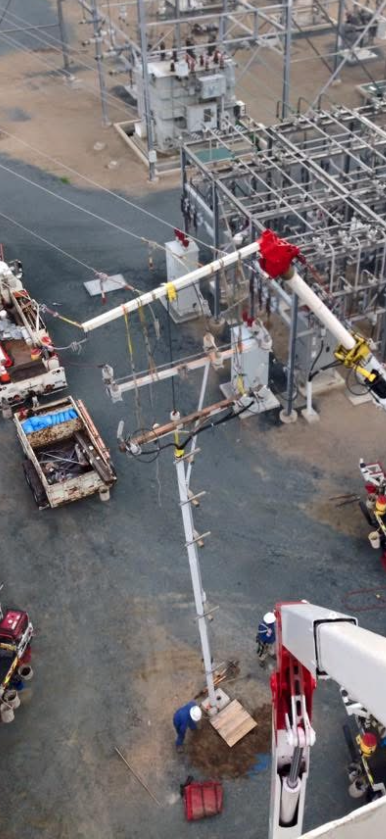 Jude Jolma sitting in an office wearing a beige electrical company shirt and cap