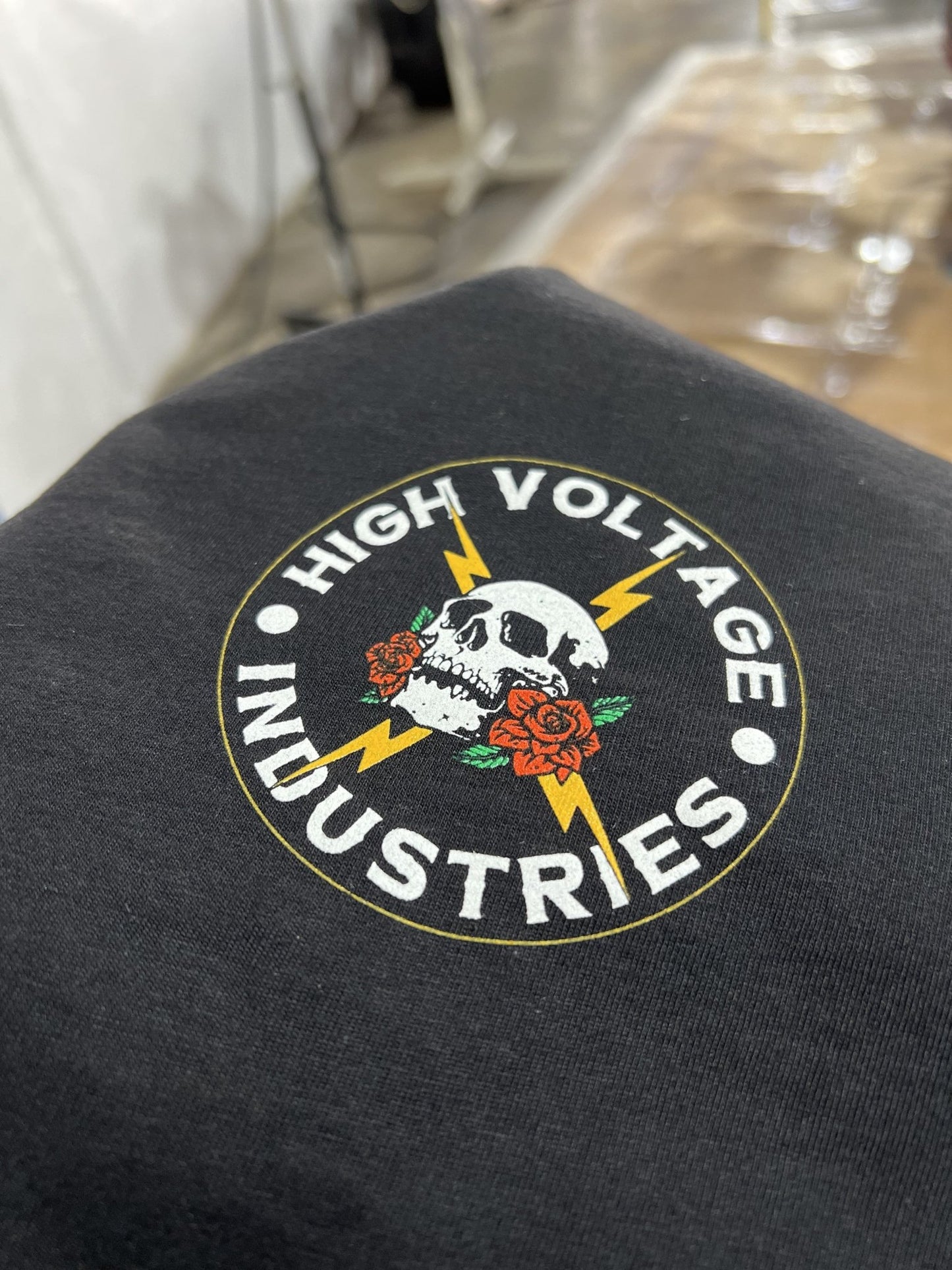 Front logo design of Guardian Tee - High Voltage Industries