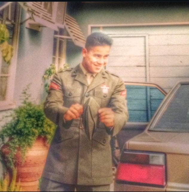 Johnny Garcia smiling in a military uniform